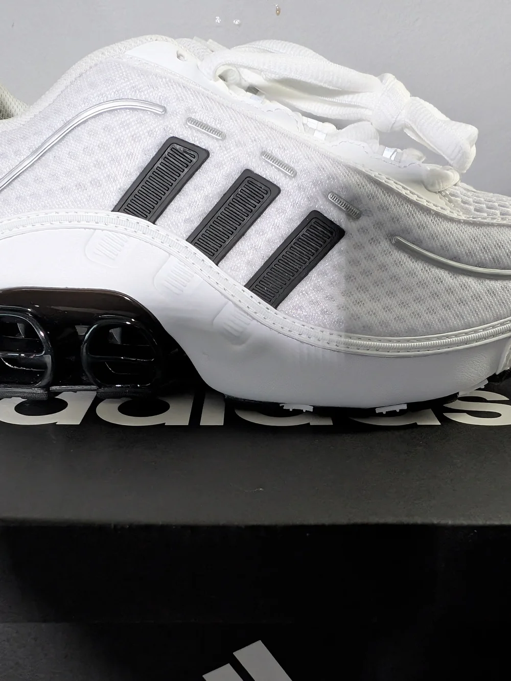 Adidas White Athletic Sneakers with Black Stripes